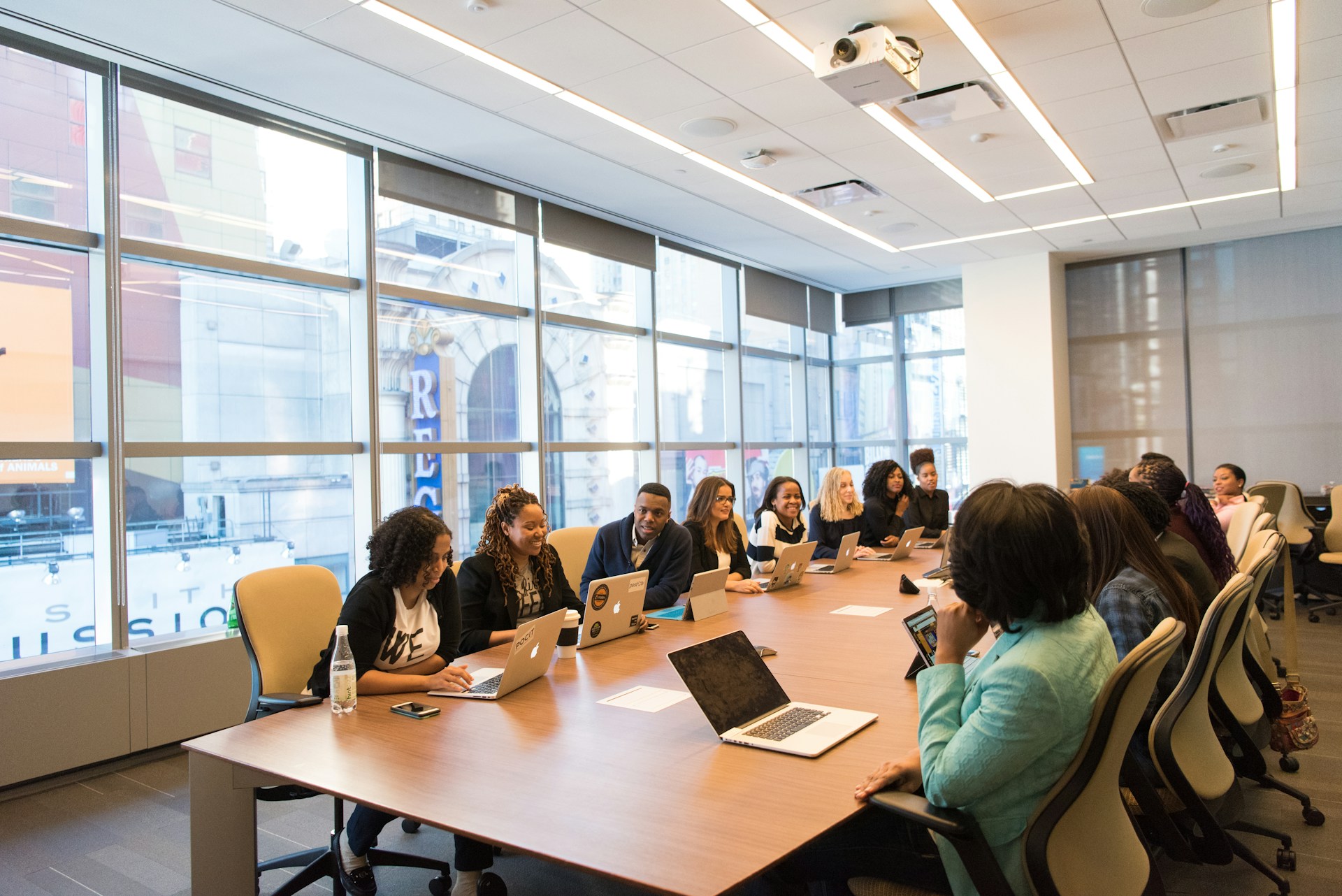 Members gathered around a conference table